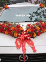 Hoa giả trang trí xe cưới tông cam đỏ sang trọng